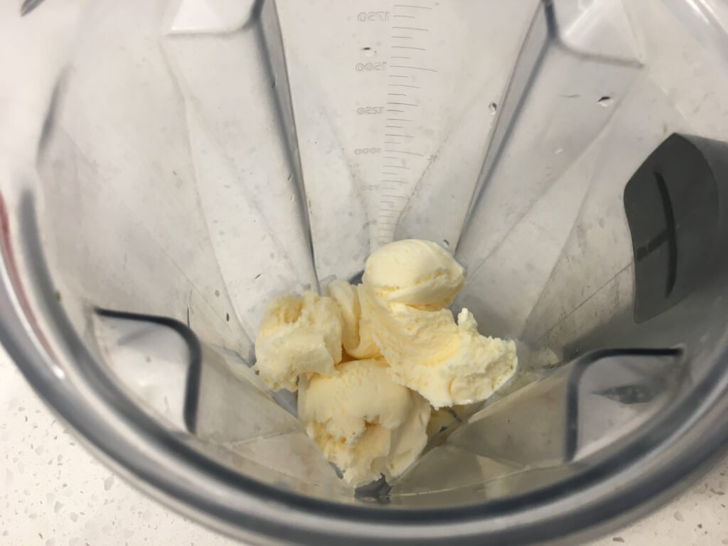 To a blender, add the ice cream. 