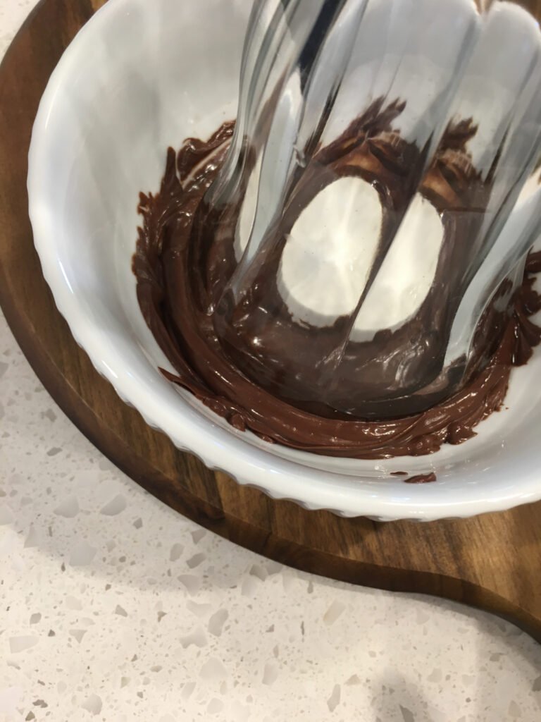 Dip each glass rim into the melted chocolate.
