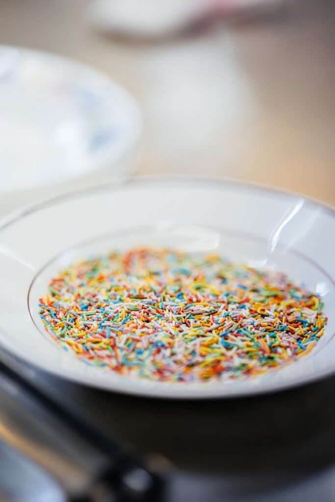 Pour sprinkles onto a shallow plate